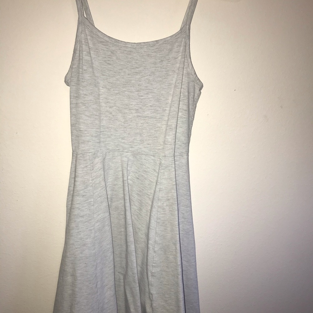 Short grey flowing tank sleeved dress.